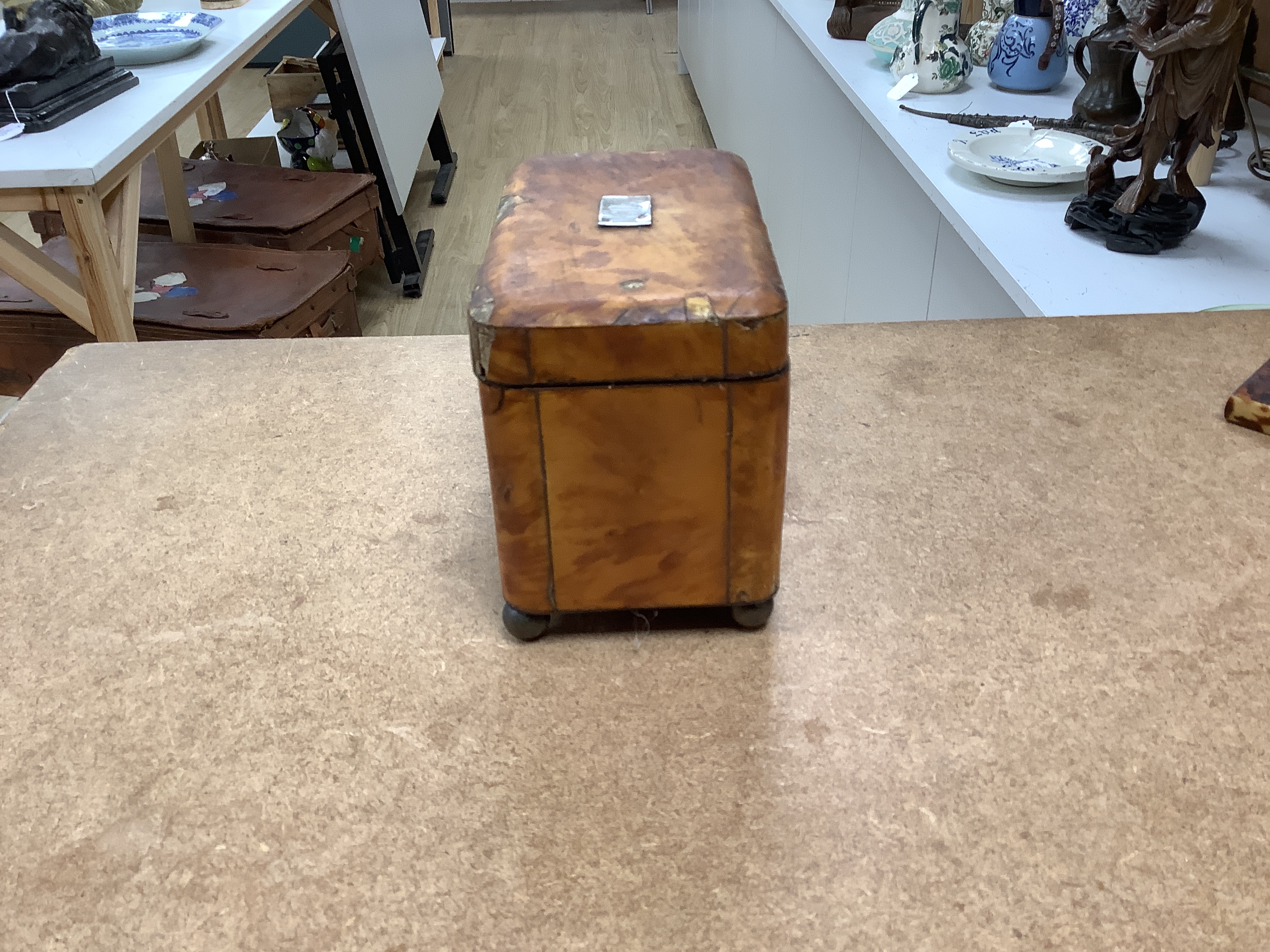 A 19th century two section tortoiseshell tea caddy on ball feet, a tortoiseshell necessaire case and a tortoiseshell and mother of pearl inlaid card case. tea caddy 15cm wide x 11cm high x 9cm deep CITES Submission refer